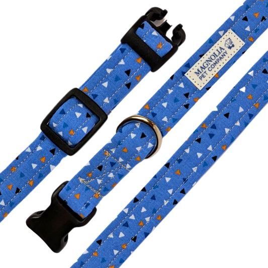 featuring a modern design of orange and blue geometric shapes. This collar's light blue backdrop provides a serene and refreshing base, while the bold geometric patterns add a contemporary flair.&nbsp;