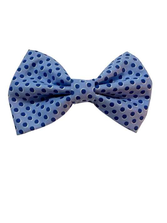 soft grey-blue fabric adorned with medium-sized polka dots in a complementary medium blue