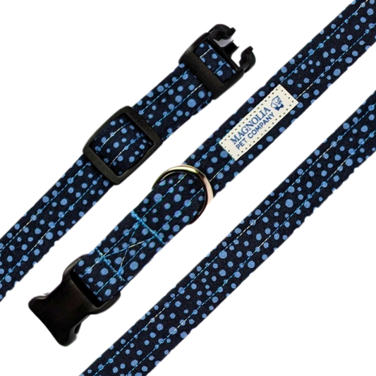 Featuring a deep navy background adorned with charming blue polka dots