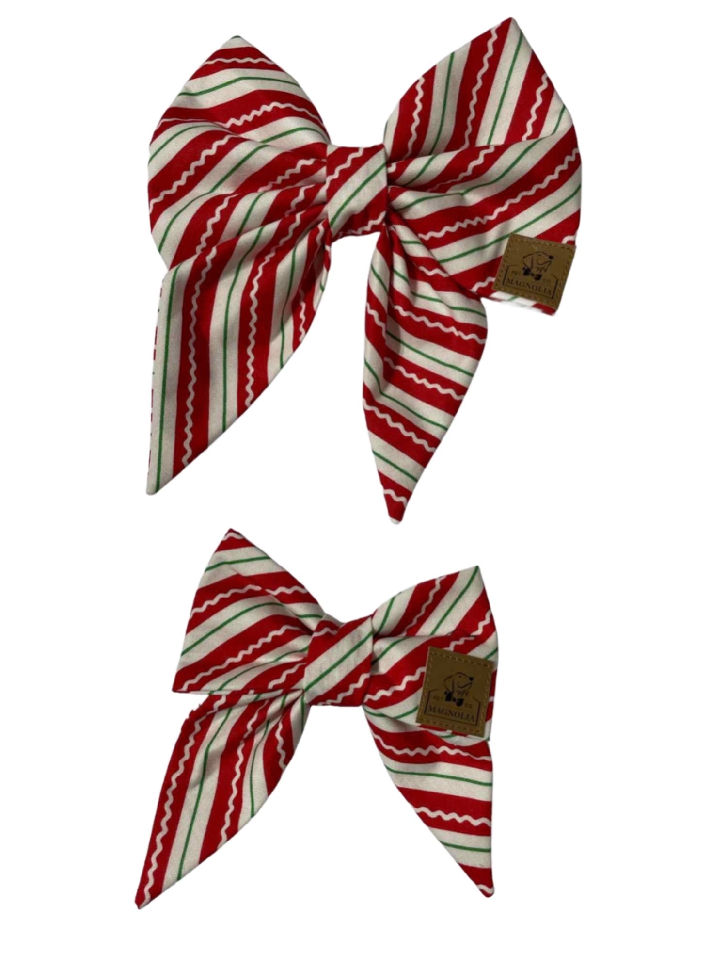 Dog bow featuring playful red and green diagonal stripes, reminiscent of classic candy canes by Magnolia Pet Company.