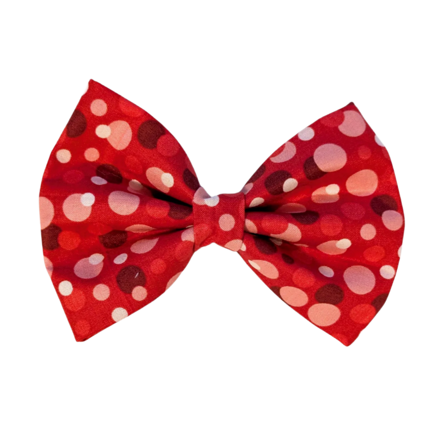 Crafted from bright red fabric with large polka dots in varying shades of red