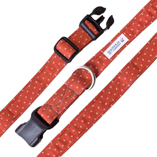 burnt orange dog collar, featuring a subtle pattern of petite X’s