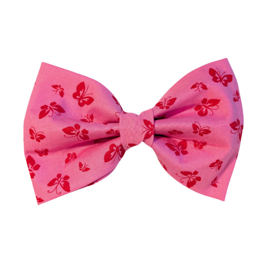 vibrant bright pink fabric adorned with playful hot pink petite butterflies