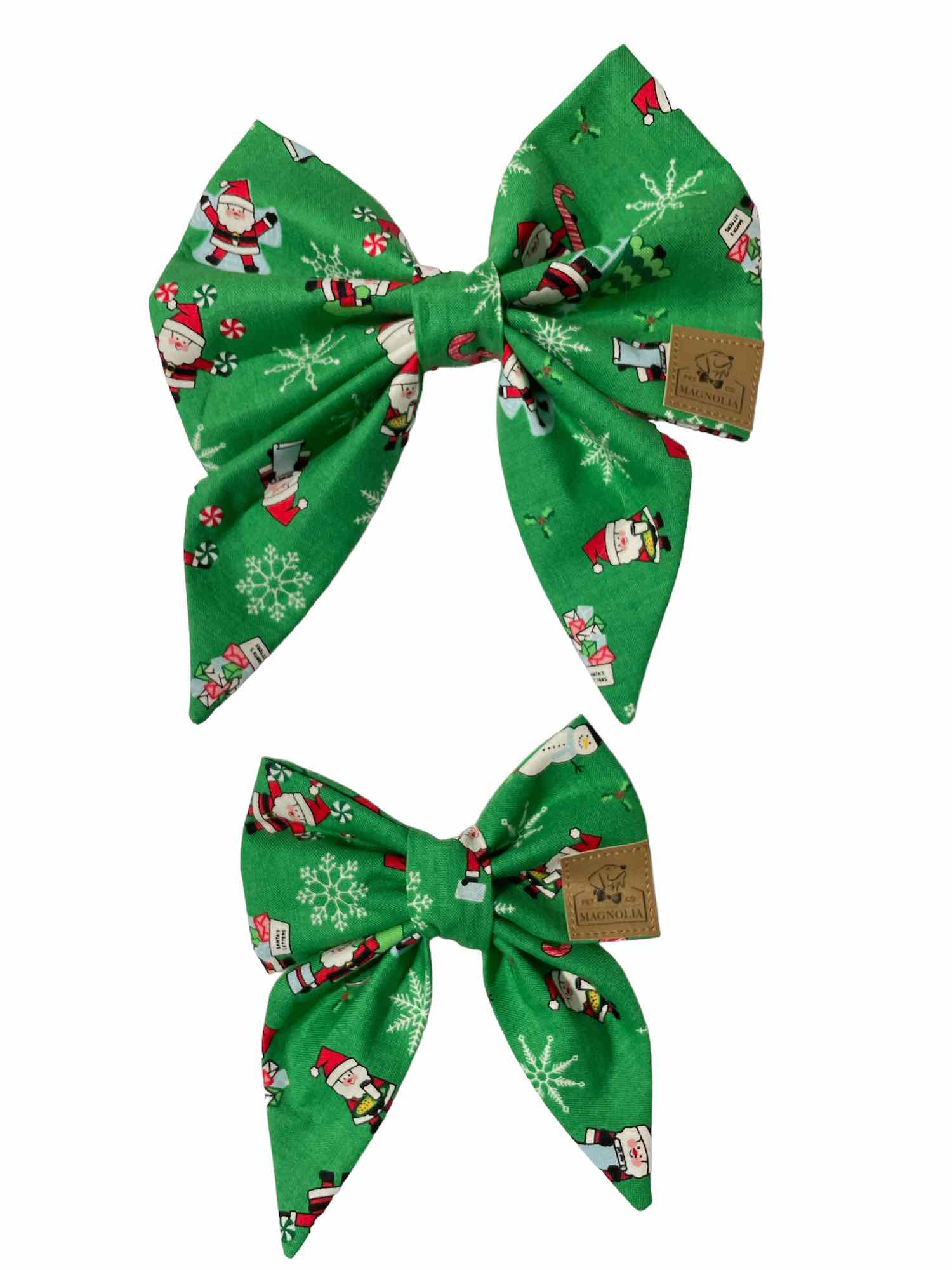 This festive accessory features a vibrant bright green fabric adorned with cheerful Santa Claus illustrations.