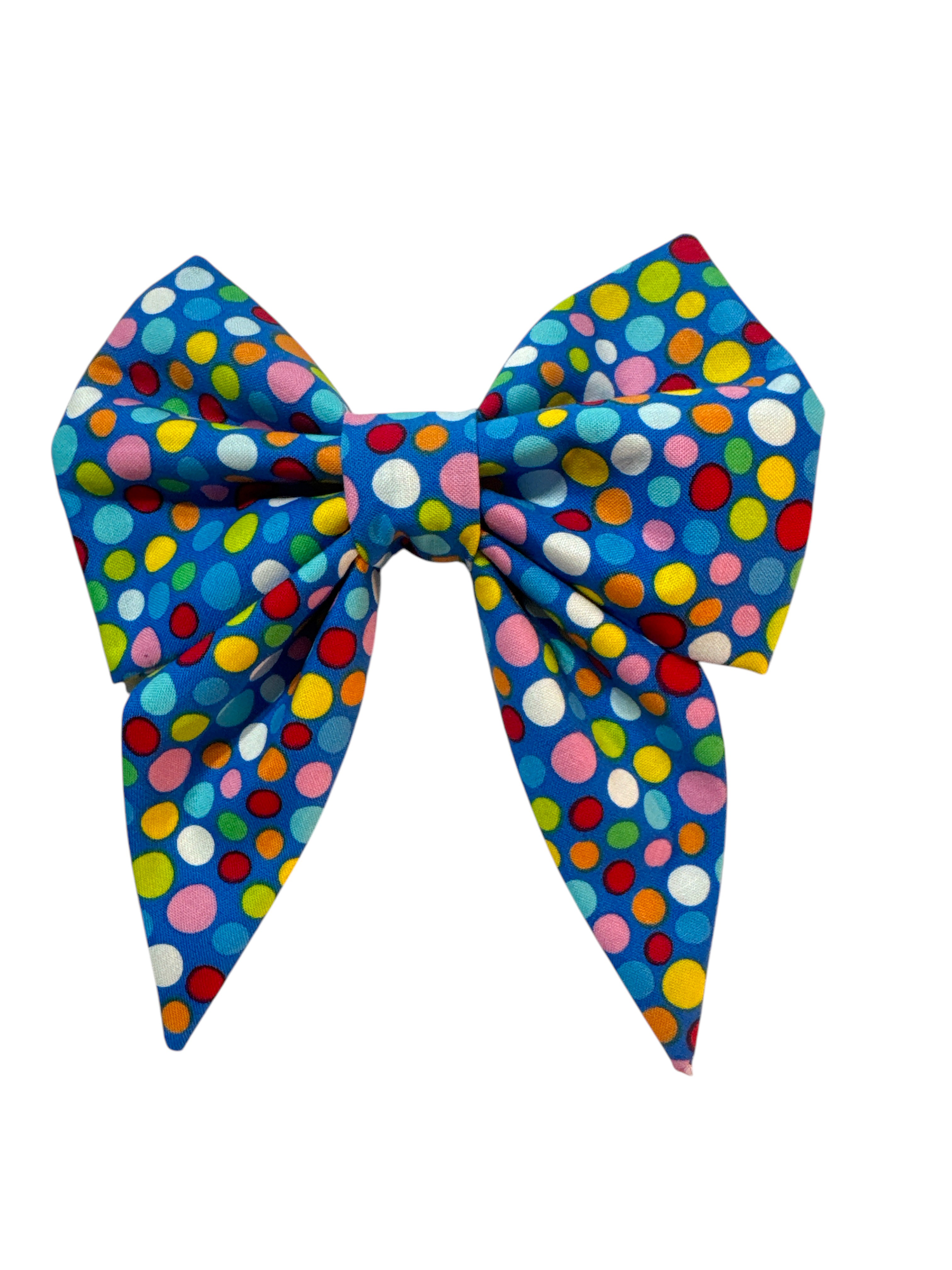 Featuring large polka dots in lime green, white, pink, orange, and blue, this playful bow is set against a bright blue fabric