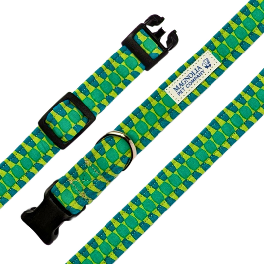 This eye-catching collar features a vibrant bright green fabric adorned with a dynamic zipper-like pattern in darker and lighter green shades