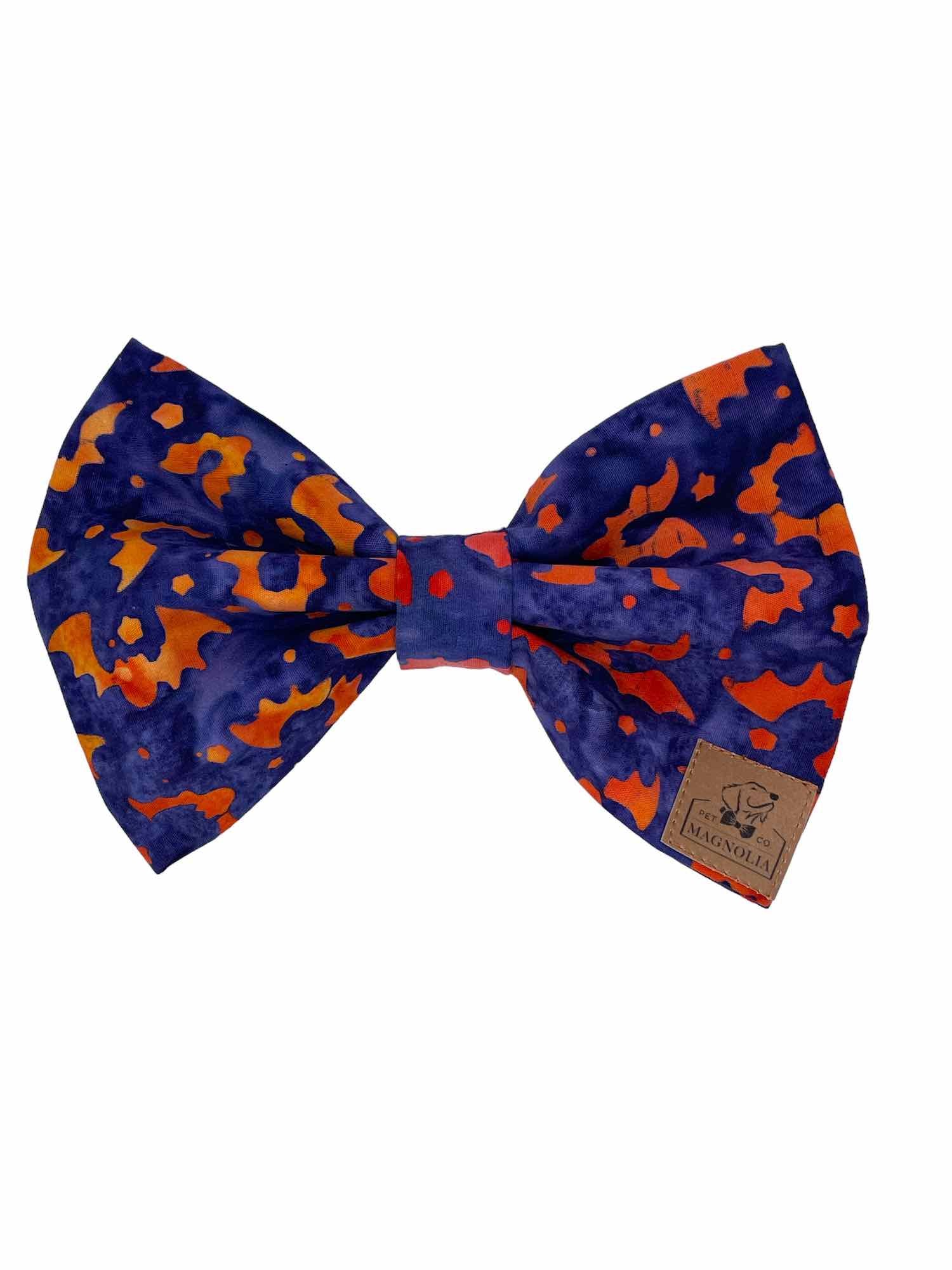 Featuring a dark blue background adorned with bright orange bats