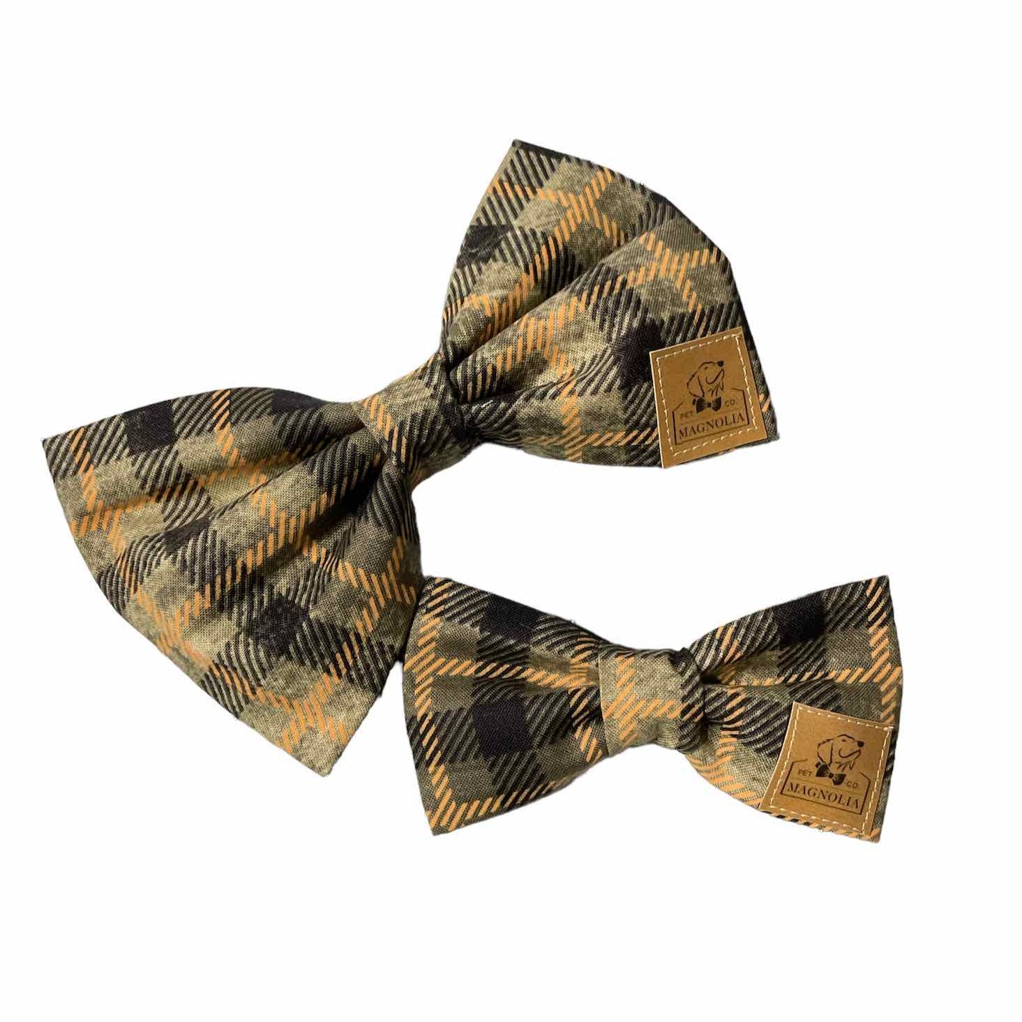 Fall into fall with our Autumn Plaid Dog Bow Tie – the perfect accessory to embrace the cozy vibes of the fall season!  Crafted with care and attention to detail, this bow tie features a textured plaid pattern in rich shades of black, orange, and brown, capturing the essence of autumn's warmth and beauty.